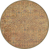 The Blossom Breeze - Washable Rug - JR1752 is a round, vintage-style flat weave rug with a faded geometric and floral pattern in earthy brown, gold, purple, and green tones. Its symmetrical design is both intricate and washable for easy care.