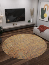 A modern living room features the Blossom Breeze - Washable Rug - JR1752 (Custom Size) on dark wood floors, a wall-mounted TV, low console, plants, abstract art, and a chaise lounge with an orange blanket—ideal for high-traffic spaces.