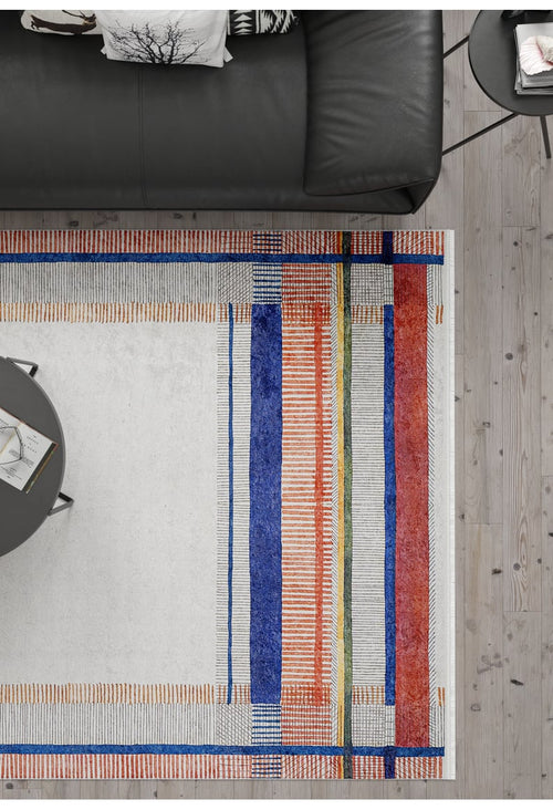 Bild 1 in Galerieansicht laden. A modern living room with a black leather sofa, round gray coffee table and the Bohemian Nightscape - Washable Rug - JR1701, featuring bold geometric patterns in blue, orange, green, and red—perfect for high-traffic areas on a light wood floor.