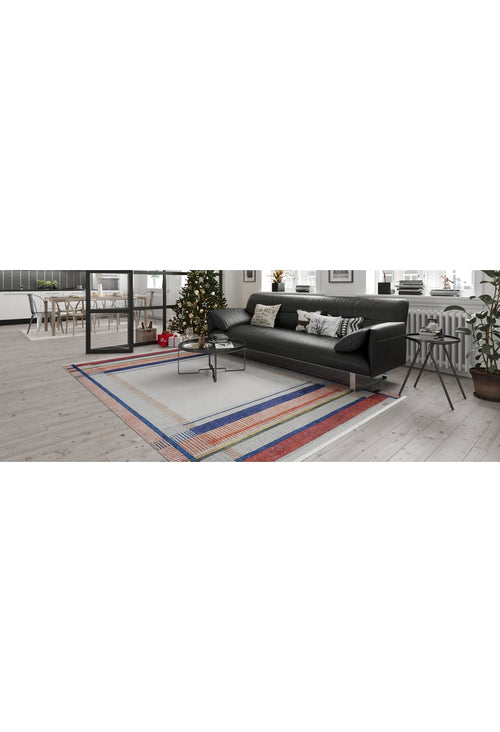 Bild 1 in Galerieansicht laden. A modern living room featuring a black sofa, Bohemian Nightscape - Washable Rug - JR1701 in red, a coffee table, a decorated Christmas tree by the window, indoor plants, and a bright dining area—ideal for high-traffic spaces.