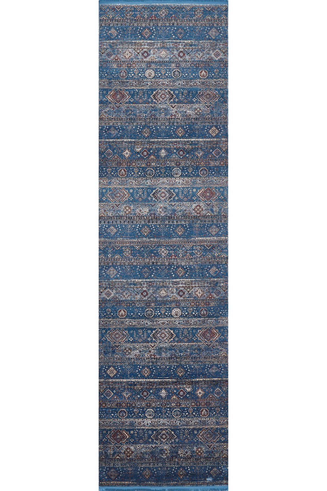 The Bohemian Tracery Rug - Blue - 2221B is a narrow, rectangular machine-made rug with a distressed blue background and intricate beige, brown, and ivory geometric and floral patterns in horizontal stripes.