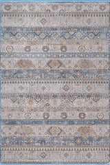 The Bohemian Tracery Rug - Grey - 2221C is a large machine-made rug with geometric and floral patterns in blue, beige, cream, and brown stripes for a distressed, vintage style.