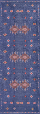 The Boho Chic Tapestry - Washable Rug - JR5083 is a rectangular blue rug with geometric patterns in white, red, orange, and pink. It features three central medallions, smaller shapes, and a simple border in a symmetrical design.