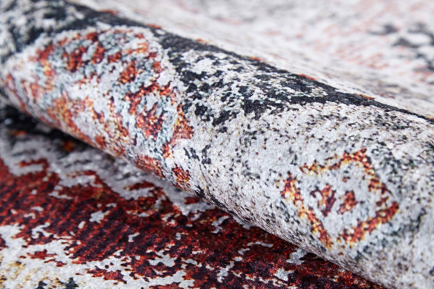 A close-up of the Boho Oasis - Washable Rug - JR1618 (Custom Size), showing its textured, patterned surface with distressed red, gray, and yellow geometric designs—perfect for high-traffic areas.