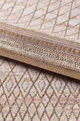 Close-up of the Boho Sunset Trellis Rug - HRD004, a machine-made beige and light brown area rug featuring textured fibers and an intricate diamond geometric pattern.