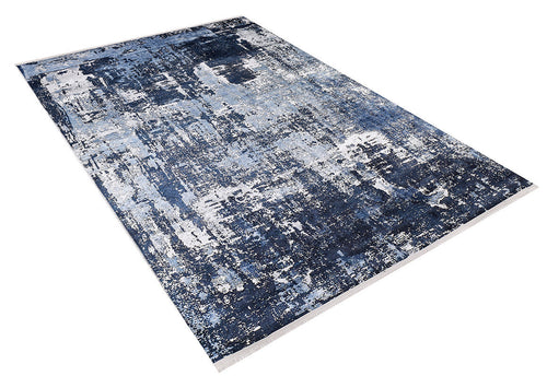 Load image 1 in gallery view. The Bold Blooms - Washable Rug - JR836 (Custom Size) is a rectangular blue rug with an abstract, textured pattern in blue, white, and gray—durable for high-traffic areas and easy to maintain, shown angled against a white background.