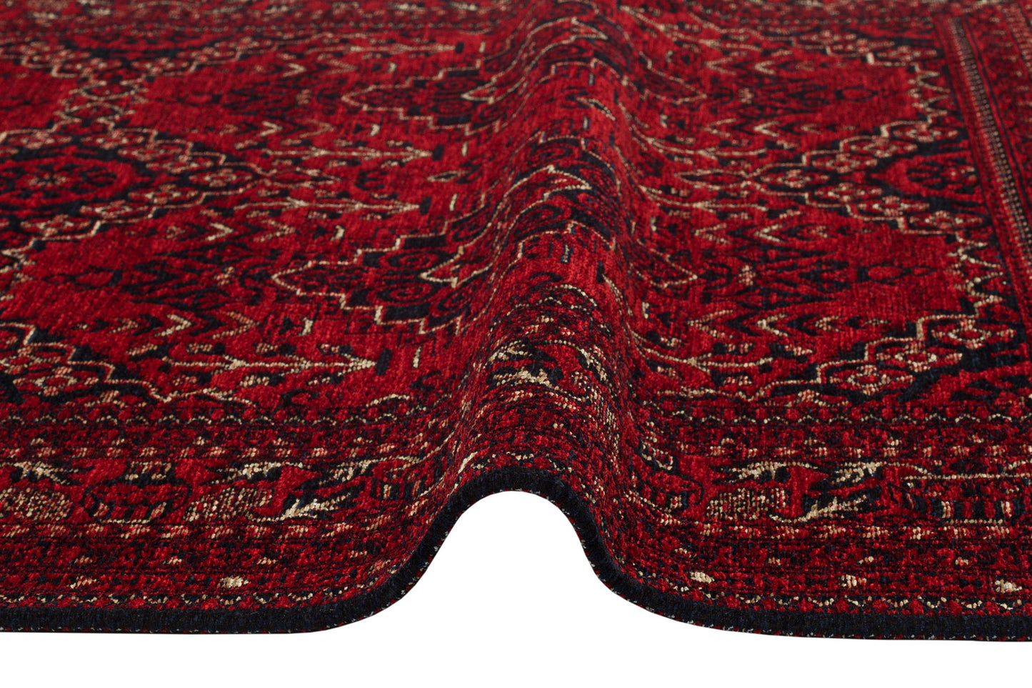 A close-up of the Bold Thread - Kilim - BHR05 rug, featuring an intricate red, black, and beige Turkish pattern with a visible ripple running through the center.