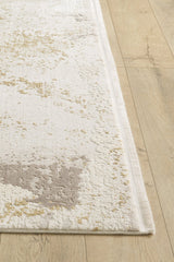 A close-up of the Bright Swirls Contemporary Rug - M657F shows its abstract beige, light gray, and cream pattern on a light wood floor. This machine-made rug has subtle textured details and finished edges.