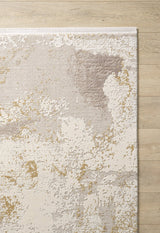 The Bright Swirls Contemporary Rug - M657F features an abstract cream, beige, taupe, and gold pattern with a white border and painterly texture, displayed on a light wooden floor. Its machine-made design adds a modern touch to any space.