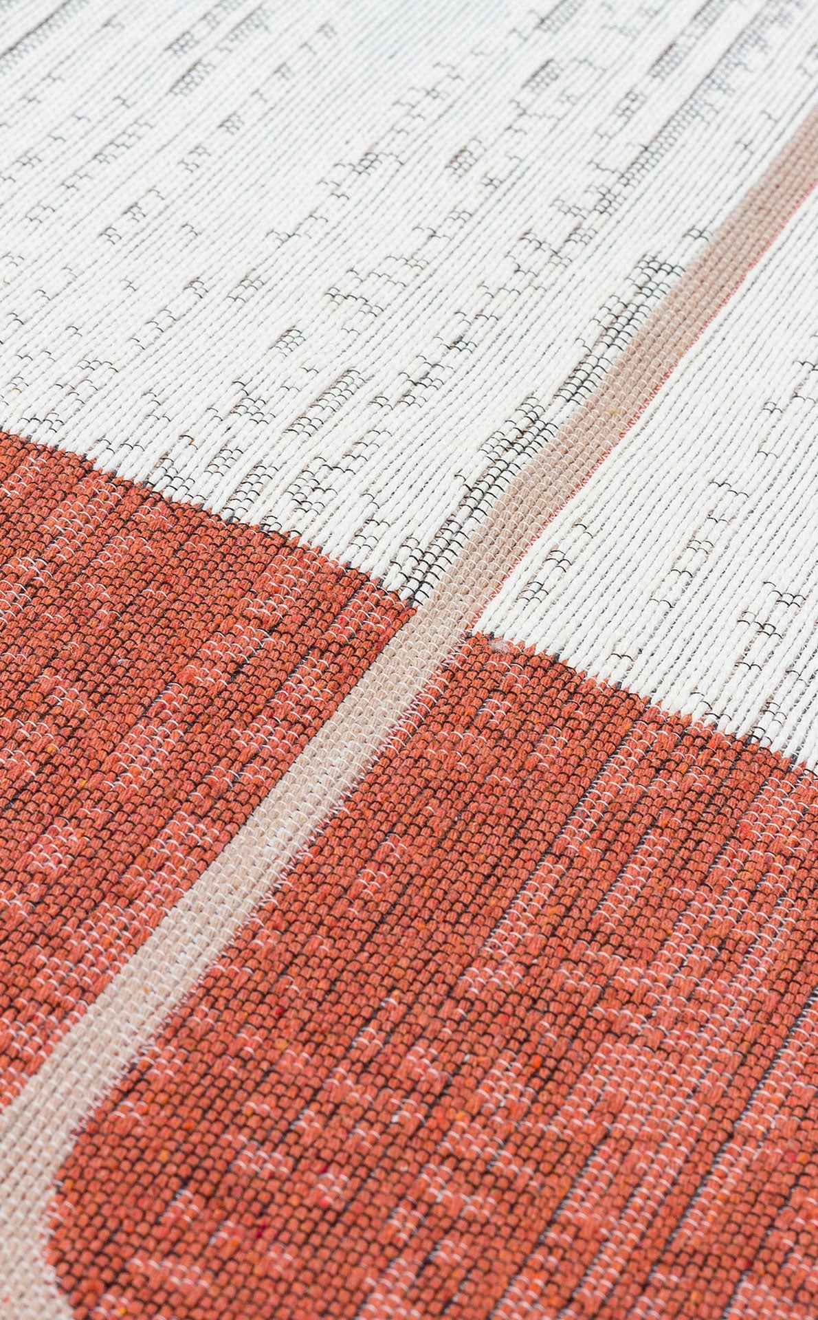 Close-up of the Burnt Stone - Washable Reversible Kilims - AR36, featuring modern geometric texture with white and reddish-orange areas divided by a thin beige stripe, highlighting the intricate flatwoven details.