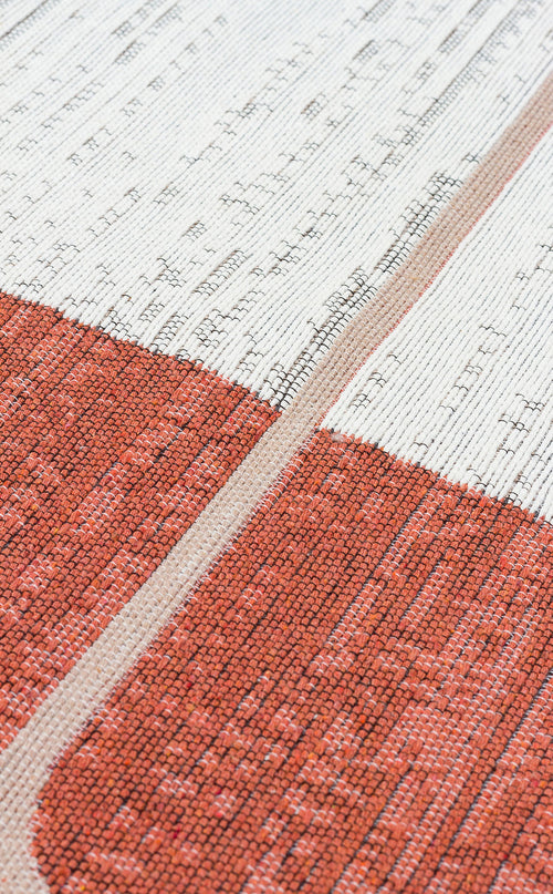 Load image 1 in gallery view. Close-up of the Burnt Stone - Washable Reversible Kilims - AR36, featuring modern geometric texture with white and reddish-orange areas divided by a thin beige stripe, highlighting the intricate flatwoven details.
