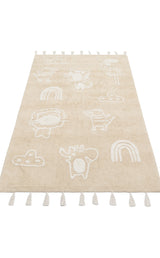 The Calm Nest - Washable Shaggy - CBN16 is an ultra-soft cream beige cotton rug with white line drawings of animals, rainbows, and clouds, finished with fringe tassels along the short edges.