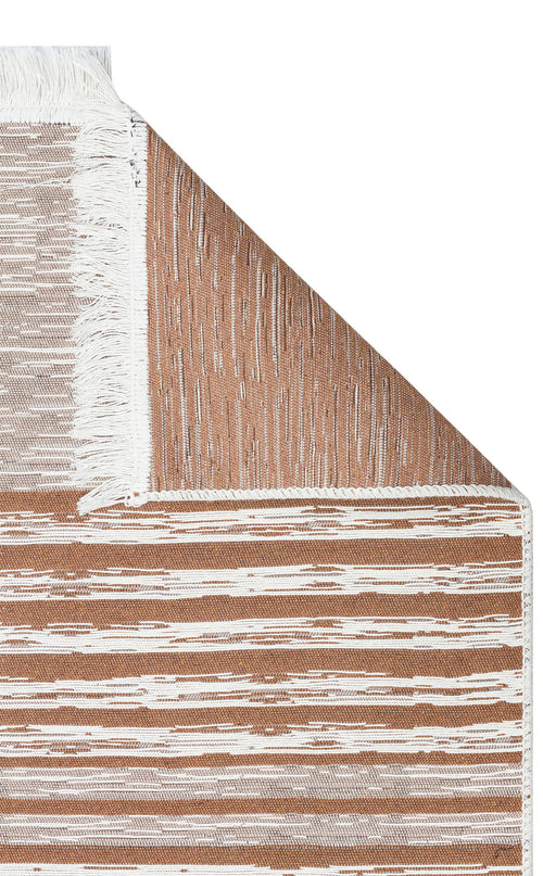 Load image 1 in gallery view. A close-up of the Calm Thread - Washable Double-Sided Kilims - AR27, a rectangular recycled cotton rug with brown and white horizontal stripes, white fringed edges, and a folded corner that reveals a similar striped pattern on the reverse side.
