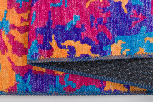 Load image 1 in gallery view. Close-up of the Celestial Tapestry Washable Rug (JRS004) in vibrant pink, orange, blue, and purple abstract patterns. Detailed stitching and dark backing are shown—perfect for high-traffic areas.