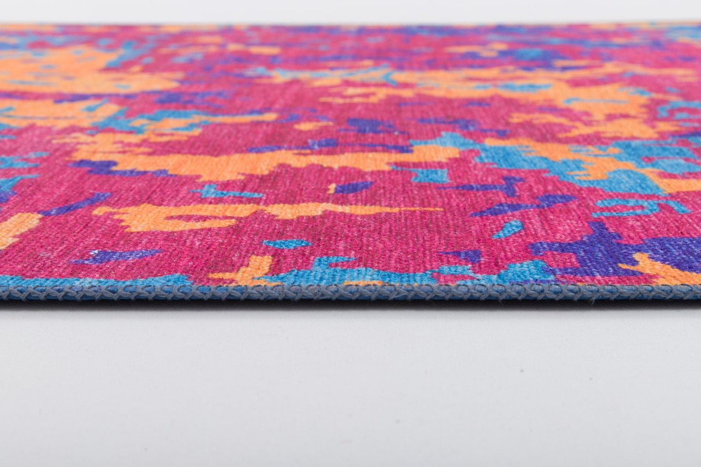 A close-up of the Celestial Tapestry - Washable Rug - JRS004 (Custom Size), featuring a colorful abstract pattern in pink, orange, blue, and purple on a white background—ideal for allergy-sensitive homes and easy to clean.