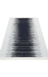The Charcoal Frame AR40 is a rectangular, double-sided kilim rug with a black-to-white gradient design, made from recycled cotton and finished with short white fringes on the shorter edges. Washable for easy care.