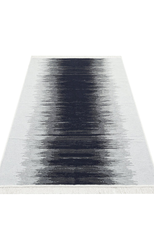 Load image 1 in gallery view. The Charcoal Frame AR40 is a rectangular, double-sided kilim rug with a black-to-white gradient design, made from recycled cotton and finished with short white fringes on the shorter edges. Washable for easy care.
