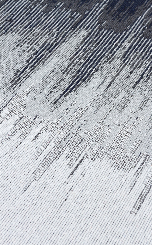 Load image 1 in gallery view. Close-up of the Charcoal Frame - Washable Double-Sided Kilims - AR40 rug, featuring a textured recycled cotton surface with an abstract linear pattern in white, gray, and dark blue that creates a striking diagonal gradient effect.