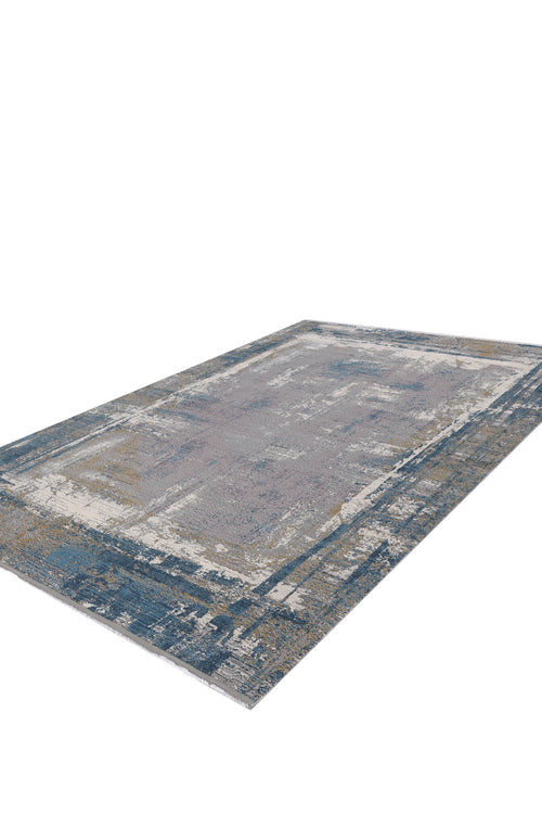 Load image 1 in gallery view. The ChromaBurst Premium Rug - Blue - MT176 is a modern, machine-made rectangular rug featuring a distressed abstract design in blue, gray, and beige, crafted from acrylic and viscose. Shown on a white background.
