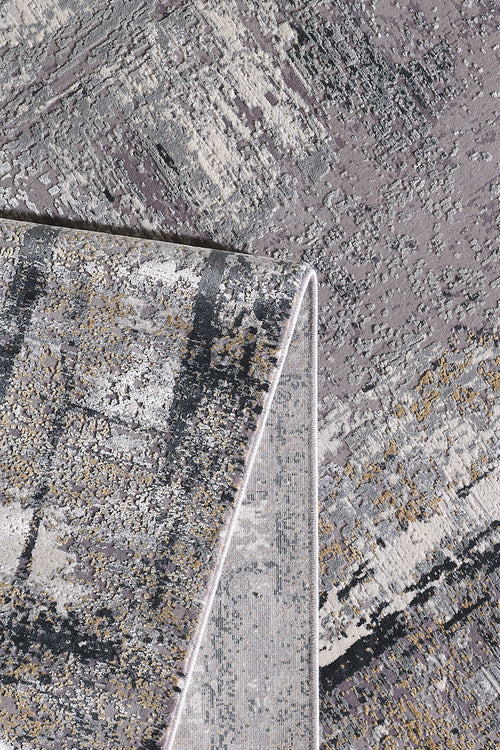 Load image 1 in gallery view. A close-up of the ChromaBurst Premium Rug - Dark - MT175 showcases abstract grey, beige, and black patterns. The flipped corner reveals its plush acrylic-viscose thickness and detailed machine-made underside.