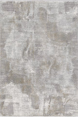 The Chromatic Flair Contemporary Rug - Latte - M660D features a modern, machine-made design with a distressed texture and painterly pattern in gray, beige, and taupe tones, offering layered shades and subtle variations for a stylish look.