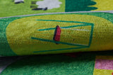 A close-up of the City Adventure - Machine-Washable Rug JRC039 (Custom Size) shows its colorful textured surface with a yellow and green background, a simple red and green chair design, and playful shapes—ideal for high-traffic areas.