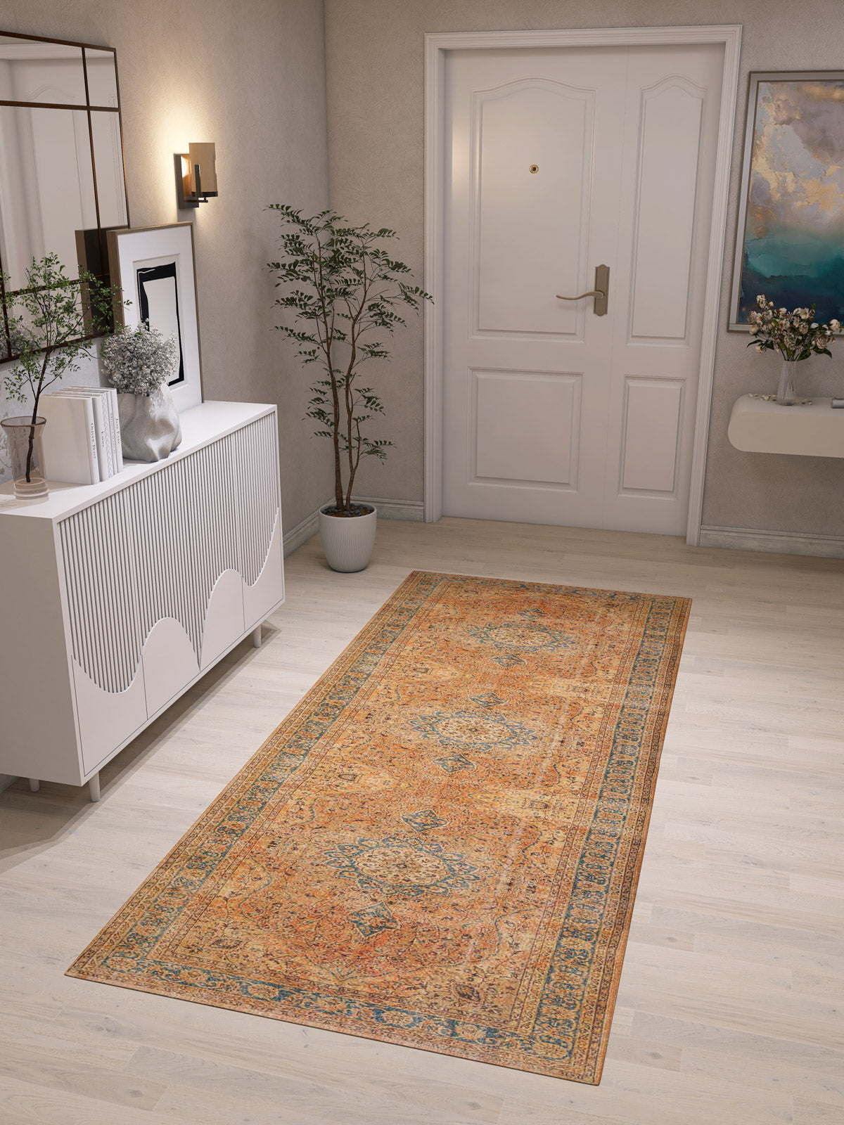 A hallway with light wood floors, the Classic Laurel - Washable Rug - JRN1022 as a vintage runner, a white console table with decor, a potted plant, wall art, and a white door at the end.