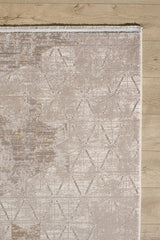The Cloudscape Geometry Modern Rug - M533B features a beige and light brown geometric pattern with a subtle design. Shown here on a light wood floor, only the upper left section is visible, displaying tasseled edges at the top.