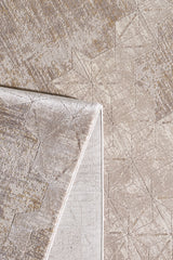 A close-up of the Cloudscape Geometry Modern Rug - M533B, featuring a beige geometric pattern and modern design. One corner is flipped to show the underside and display the machine-made texture and subtle color variations on both sides.