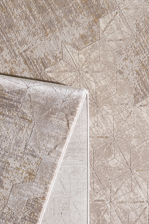 Load image 1 in gallery view. A close-up of the Cloudscape Geometry Modern Rug - M533B, featuring a beige geometric pattern and modern design. One corner is flipped to show the underside and display the machine-made texture and subtle color variations on both sides.