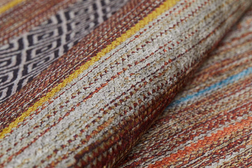 Load image 1 in gallery view. Close-up of the Coastal Breeze - Washable Rug - JR1549 (Custom Size), showcasing textured horizontal stripes in brown, orange, yellow, white, and blue with a black and white geometric diamond pattern section.