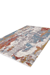 The Colorful Chaos Premium Rug - M313P is a rectangular, modern oriental rug with an abstract pattern in blue, red, yellow, gray, and white, displayed flat from a low angle.