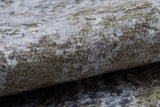Close-up of the Contemporary Canvas - Washable Rug - JR145 (Custom Size) featuring a textured, velvety surface with mottled gray and olive green tones, ideal for high-traffic areas due to its plush feel and subtle color variations.