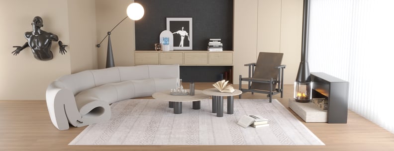 Modern living room with a curved gray sofa, sculptural wall art, coffee tables, and an armchair. The space is anchored by the Contemporary Coordinates - Washable Rug - JR750 (Custom Size) in cream and beige against a dark accent wall.