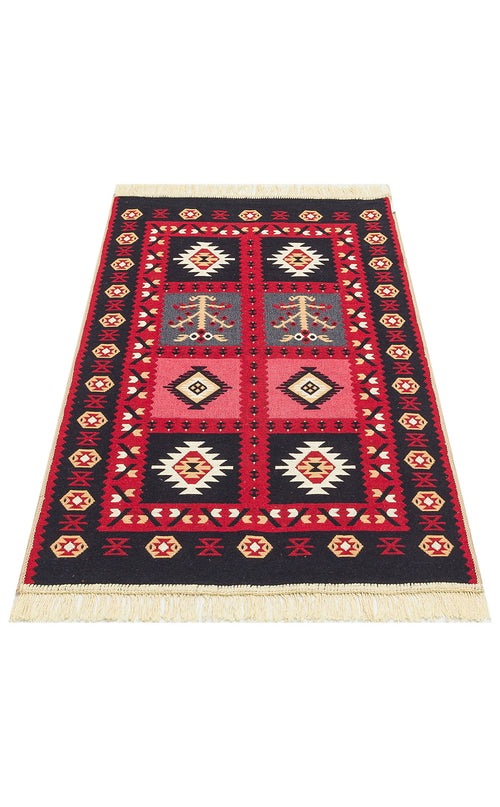 Load image 1 in gallery view. The Crimson Form - Washable Reversible Kilims - AR28 features red, black, white, and yellow diamond and star patterns in a rectangular tribal geometric design. Fringed edges on the short sides. Shown on a white background.