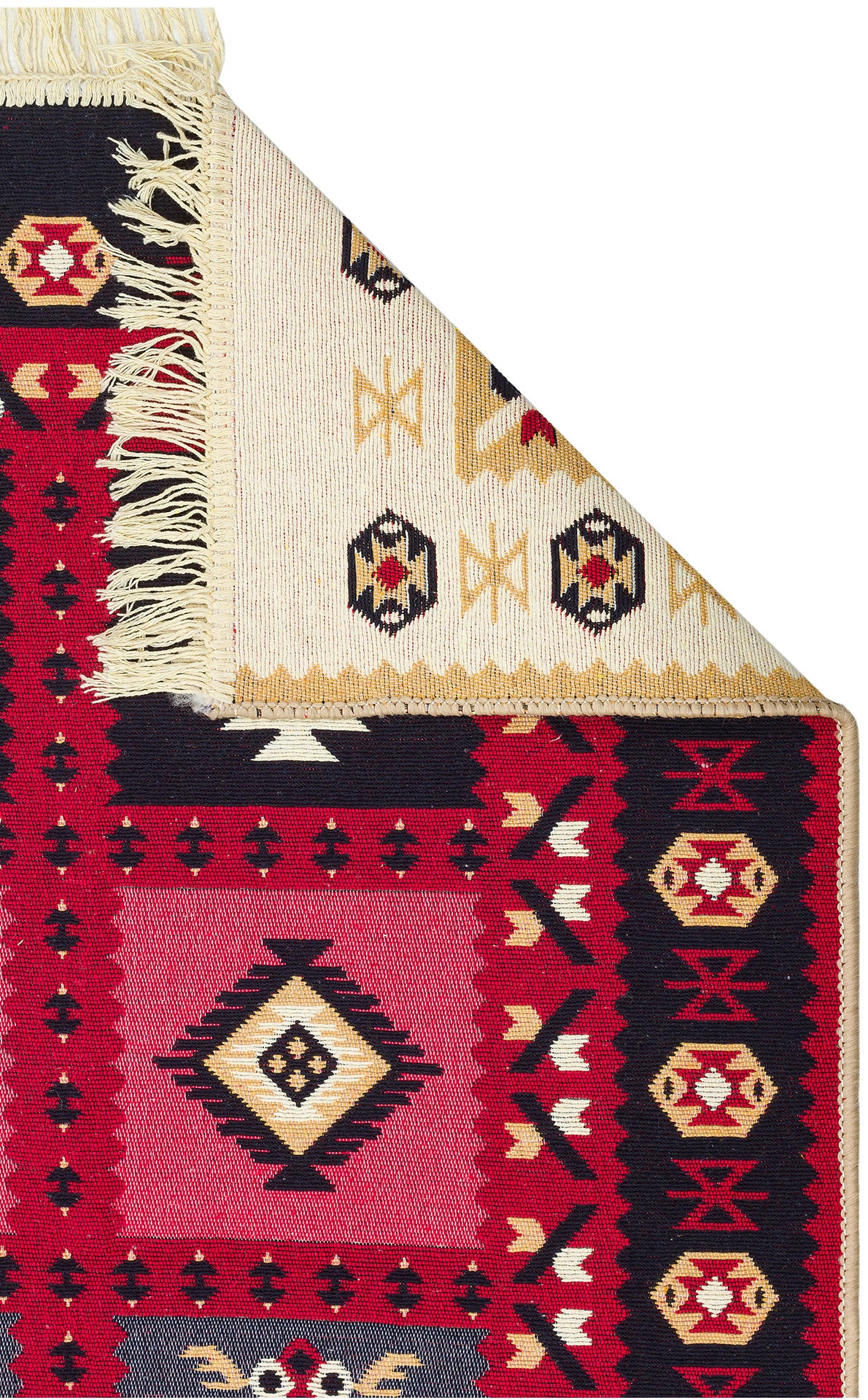 The Crimson Form - Washable Reversible Kilims - AR28 features tribal geometric patterns in red, black, cream, and yellow. A folded corner reveals its lighter underside with a similar design and fringe, highlighting its reversible style.