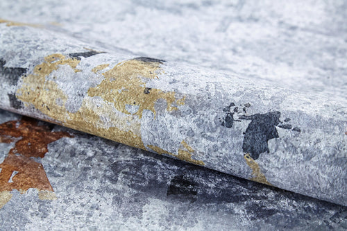 Load image 1 in gallery view. A close-up of the Cross Country - Washable Rug - JR1753 (Custom Size), featuring a textured gray pattern with gold, black, and brown patches, perfect for high-traffic areas.