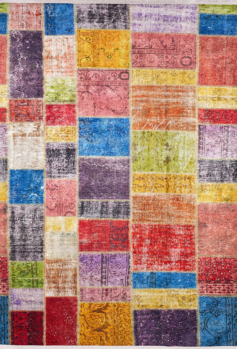The Crosshatch Craze - Washable Rug - JR210 features a vibrant grid of rectangular and square fabric pieces in bright patterns with visible stitching—ideal for high-traffic areas and available in custom sizes.