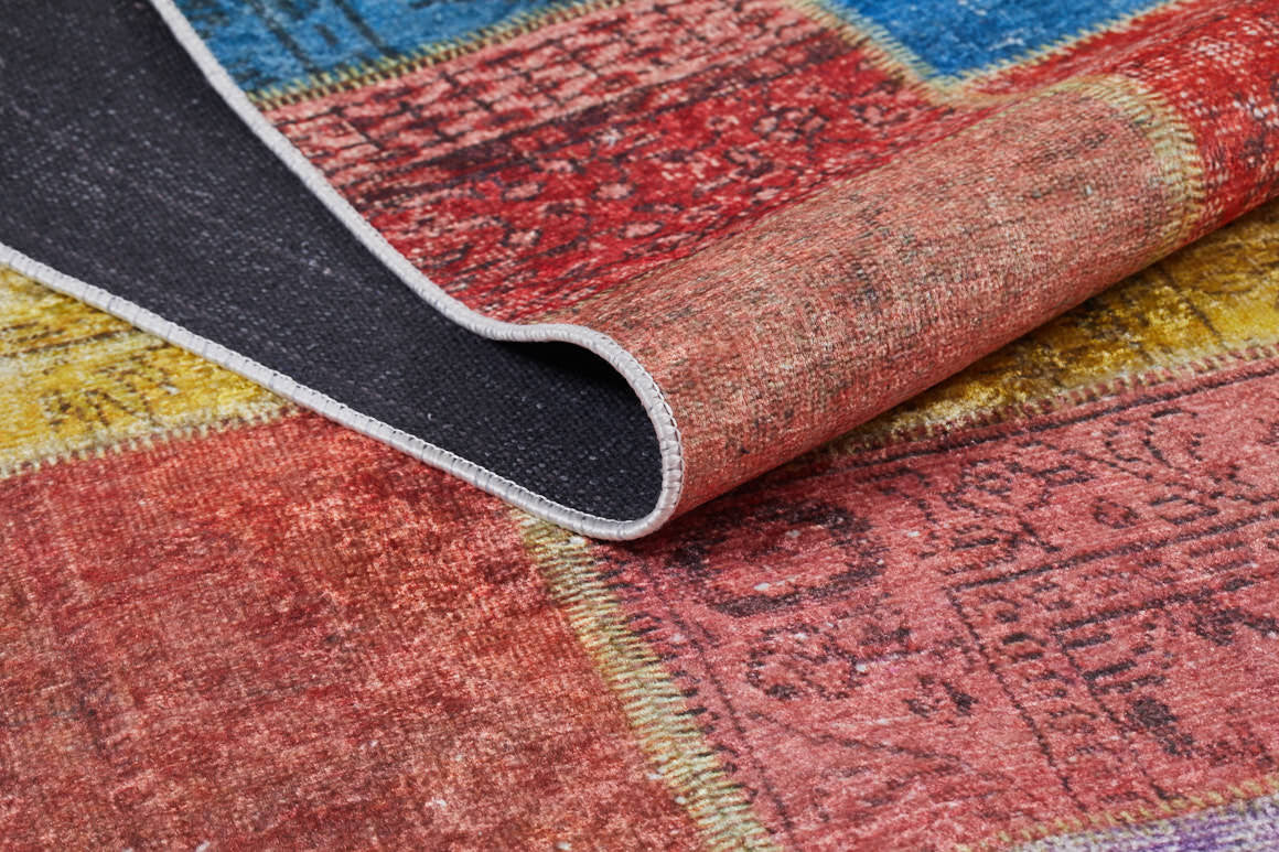 A close-up of the Crosshatch Craze - Washable Rug - JR210 (Custom Size) shows its textured surface and black non-slip backing, perfect for busy spaces, with striking red, yellow, blue, and pink patterns.