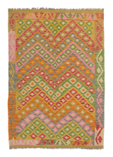 Desert Mirage - Handwoven Kilim is a vibrant flatweave rug with zigzag and diamond patterns in pink, orange, green, yellow, and gray. Colorful geometric designs and fringed edges make this rug striking and eye-catching.