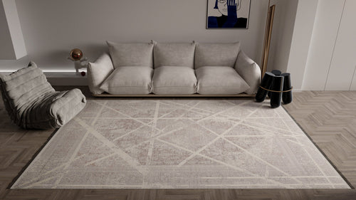 Load image 1 in gallery view. A modern living room with a light gray sofa, cushioned lounge chair, the Dominant Lineage Modern Rug - Bright - M633M, abstract wall art, a floor mirror, black side tables, and herringbone wood flooring.