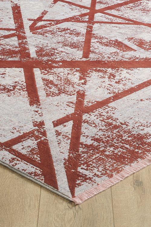 Load image 1 in gallery view. A close-up of the Dominant Lineage Modern Rug - Coral (HRD003), featuring abstract red and white intersecting lines, displayed on a light wooden floor.