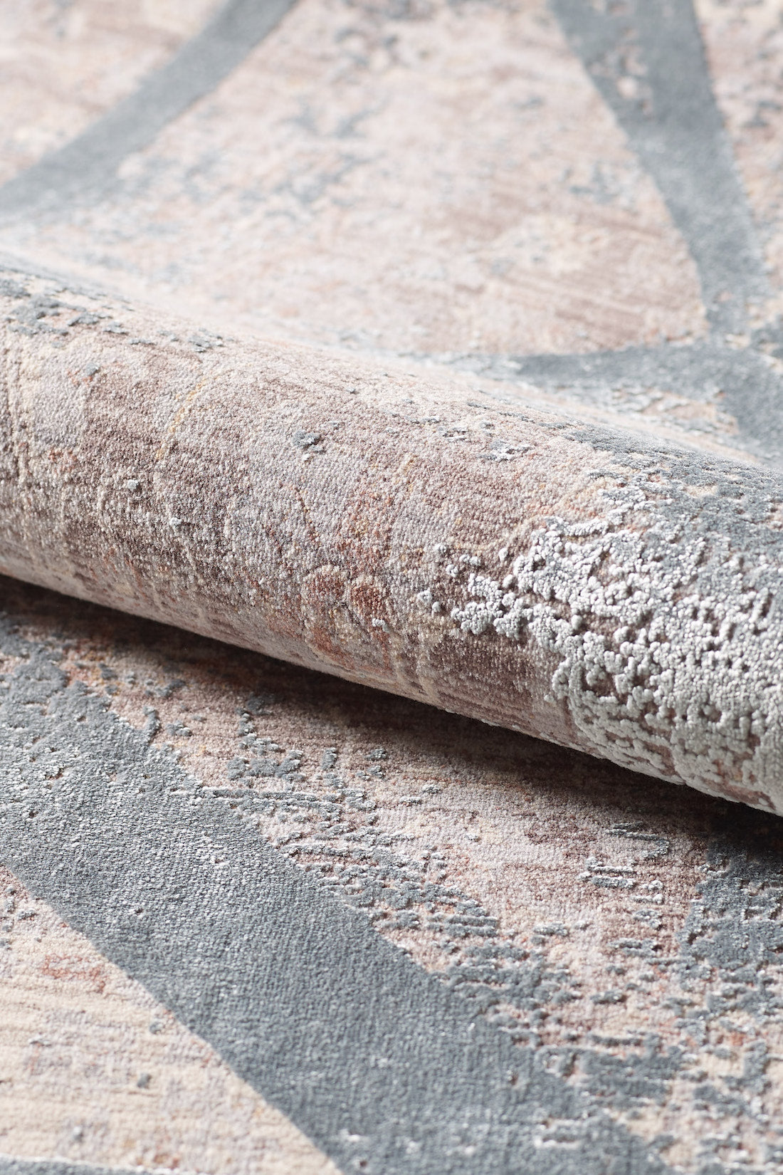 Close-up of the Dominant Lineage Modern Rug - Grey - HRD006, featuring an abstract pattern in muted tones with smooth and raised textures that highlight its intricate, industrial chic design.