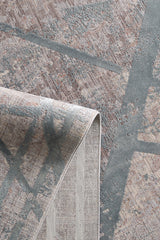 A close-up of the Dominant Lineage Modern Rug - Grey (HRD006) shows its abstract geometric patterns in muted tones. One corner is folded over, displaying the textured underside of this stylish contemporary area rug.