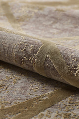 A close-up of the Dominant Lineage Modern Rug - Harvest - M633N shows its luxurious, velvety, machine-made surface with raised details and abstract gold and beige patterns on a muted brown background.