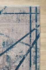 The Dominant Lineage Modern Rug - Teal - HRD010 features a beige and teal geometric pattern with bold intersecting lines over a faded traditional design, and is displayed on a light wood floor.