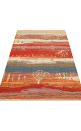 The Dust Trace - Kilim - NMD12 is a rectangular, modern kilim rug with horizontal stripes in warm reds, oranges, and yellows, accented by small tree and animal motifs throughout the pattern.