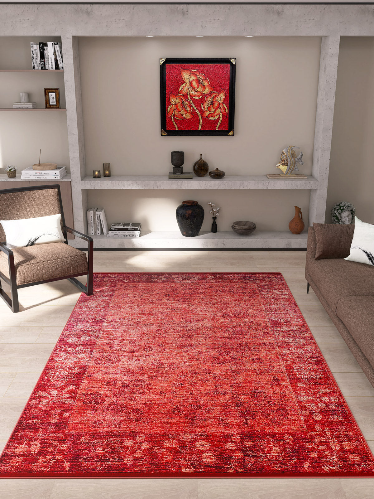 A modern living room with beige walls, brown sofas, built-in shelves with decor, and a framed red floral artwork above. The Dynasty Dream - Washable Rug - JR160 (Custom Size) in red with an oriental pattern adds warmth to the space.