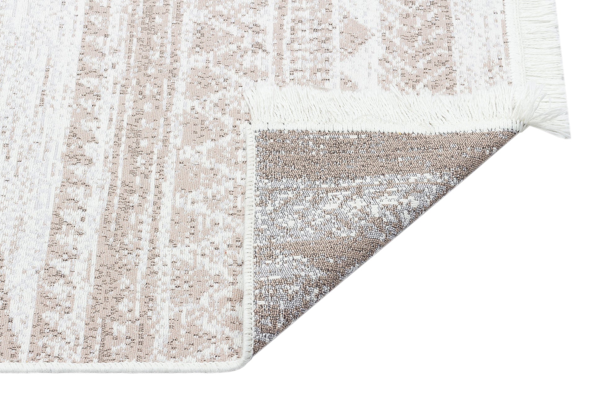 A corner of the Earth Lines - Washable Double-Sided Kilims - AR06 rug, allergy-friendly with beige, white, and brown geometric patterns, is flipped to reveal matching designs on the reverse and a fringed edge.