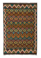 The Earthly Lines - Handwoven Kilim features a diamond pattern in red, yellow, orange, green, and blue, accented with bold zigzag borders and finished with fringed edges.
